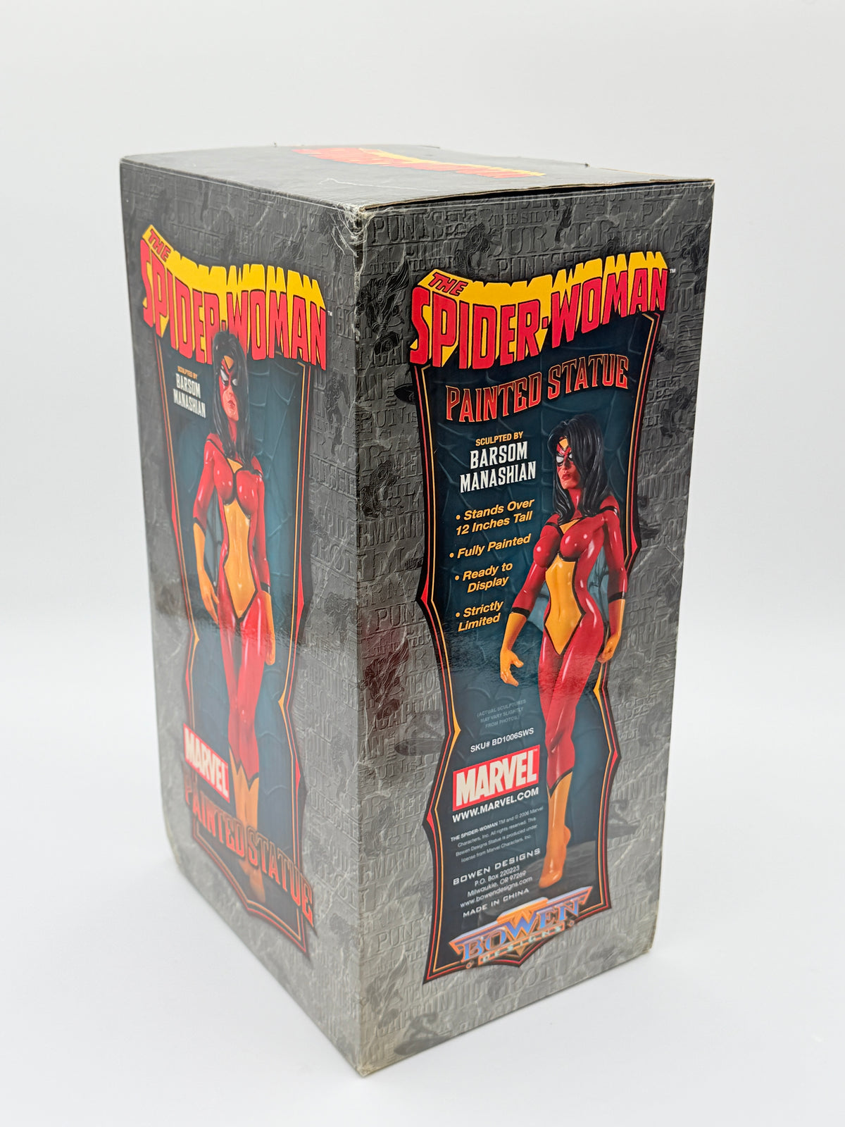 A vintage Marvel Spider-Woman painted figure box, sealed in clear plastic shrink wrap, photographed on a white background.