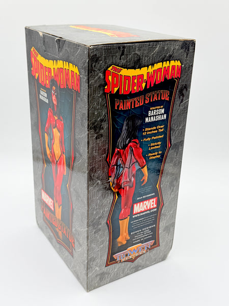 Vintage Marvel Spider-Woman painted statue box, featuring a gray textured background with red and yellow Spider-Woman graphics and an illustration of Betsy Ross Hanasham.